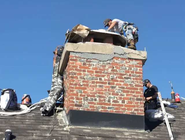 Fountain Chimney Sweep installing a custom chimney crown in Fountain, CO
