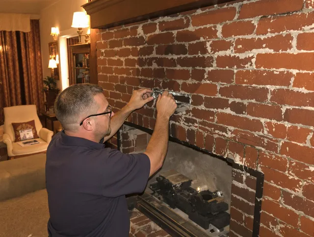 Fountain Chimney Sweep expert fixing a fireplace in Fountain, CO